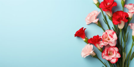 Spring flowers red white LISIANTHUS AND EUSTOMA. Bouquet of flowers on pastel background. Valentine's Day, Easter, Birthday, Happy Women's Day, Mother's Day. Flat lay, top view, copy space for textの素材