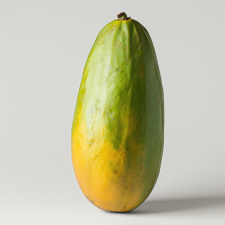 Whole papaya fruit isolated on white backgroundの素材