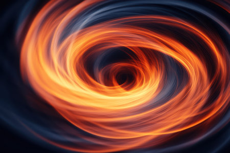 A vivid close-up of a fiery spiral against a stark black background, showcasing dynamic movement and intense color contrast.の素材