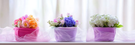 Three flower pots with colorful blooms adorn a sunny window sill for Easter celebrations ,.,の素材