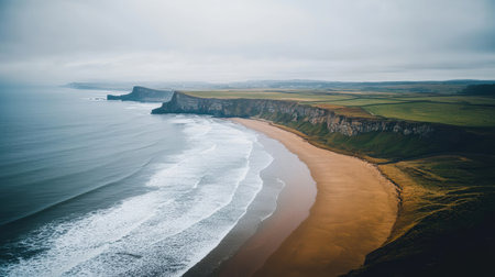 Aerial view showcasing a stunning beach alongside a majestic cliff,.の素材