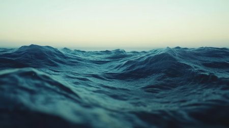 A close-up view of a vast water body beneath a clear sky backdrop,.の素材