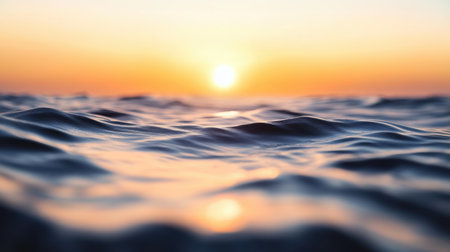 A vibrant sunset casts colorful reflections on tranquil water,.の素材