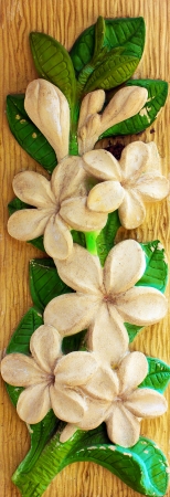 Flowers made of plastic decoration on the wooden board の写真素材