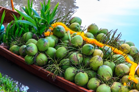 coconut on row boat is sell for people. の写真素材