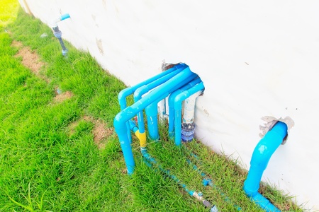 Peps blue through  wall for send water out buildingの写真素材