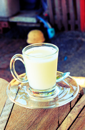 Milk white hot  on chair for kid  process vintage styleの写真素材