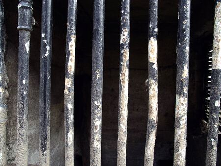 Iron bars in the prison. The old ruins. The tank chamber in the dungeon.