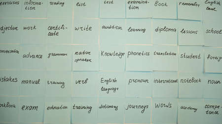 Learning english tags on stickers. Education concept, blue adhesive stickyの写真素材