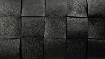 Black leather square pattern background. Retro fashion wallpaper.の写真素材