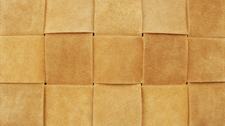 Brown suede square pattern background. Closeup vintage texture, retro fashion wallpaper. Beige...