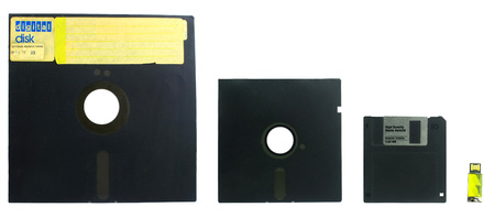 old diskettes set and flash disk isolated on white background