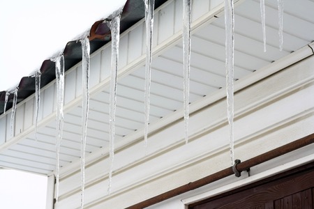 spring icicles on the roofの写真素材