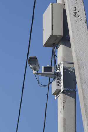 Traffic camera against blue sky