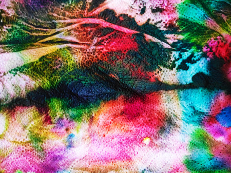 Texture, background, pattern. Silk fabric with a pattern of multicolored spots of different shades...