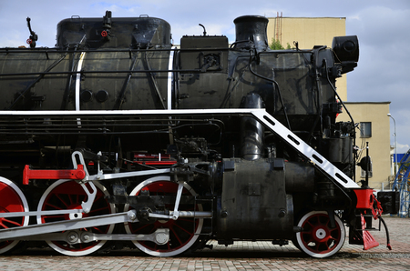 Wheels of an old black soviet steam trainのeditorial素材