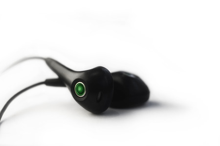 Small headphones isolated on a white background. Music listening conceptの写真素材