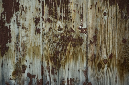 The texture of weathered wooden wall. Aged wooden plank fence of vertical flat boards.の写真素材