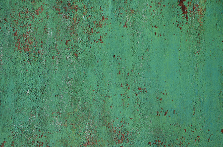 Rusty metal texture with scratched surface. Old painted metal wall with peeling paint. Texture obsolete painting metal fence close-upの写真素材