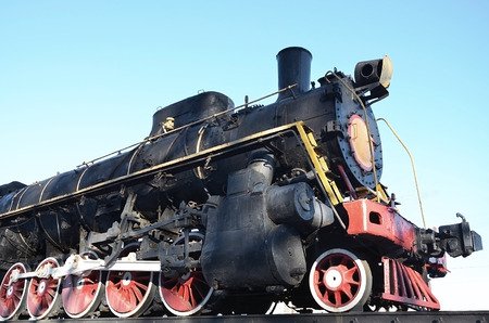 Antique black retro-train on track. A monument to the industrial achievements of the Soviet Union
