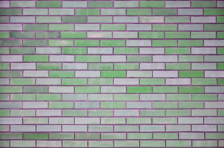 The texture of wall from a variety of old and dirty brick. Detailed pattern of a plurality of different sizes of brick colored worn outの写真素材