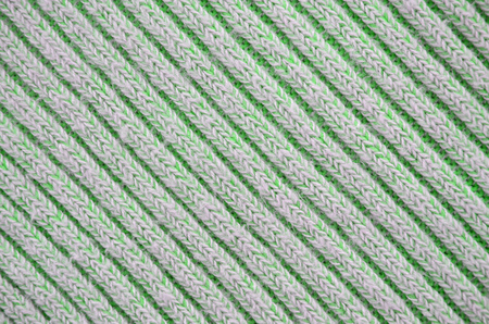 Fabric texture. Cloth knitted, cotton, wool background. Close-up of seamless gray knitted fabric...