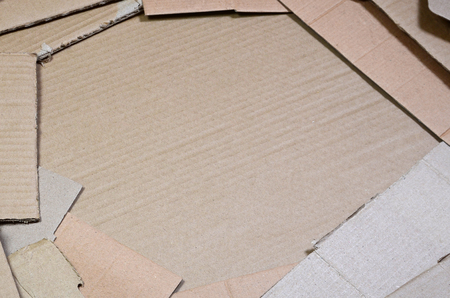 Background image with a lot of beige cardboard paper, which is used to make boxes for the transport of home appliances and postal parcels. Carton textureの写真素材