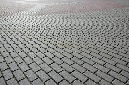 A large area, covered with a quality paving stone in daylightの写真素材