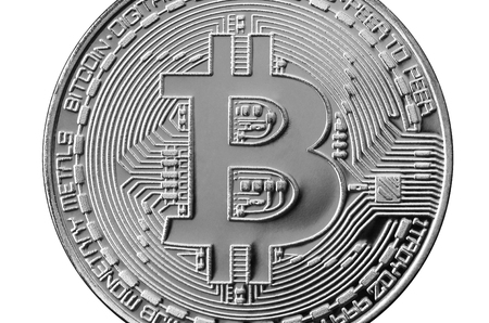 Bitcoin. Physical bit coin. Digital currency. Cryptocurrency mining concept. Silver coin with bitcoin symbols isolated on white backgroundの写真素材