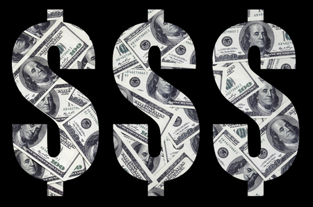 The symbol "Dollar" on a black background. A pattern from the set of scattered dollar bills as a filling characterの写真素材