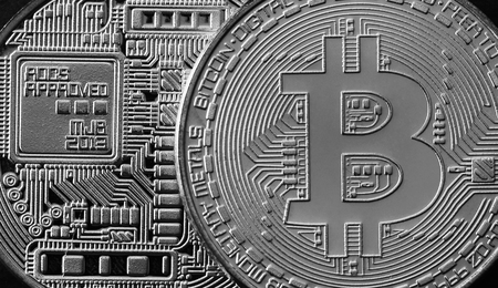 Macro photography of a silver bitcoin. Close up shiny metal texture. Abstract business and modern technology background. Cryptocurrency mining conceptの写真素材