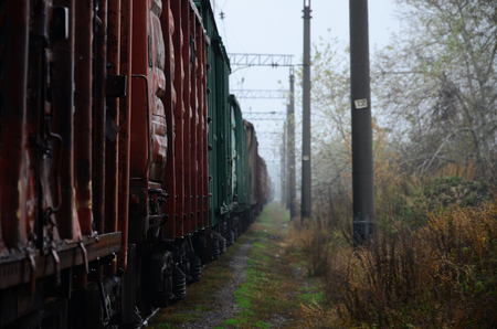 Photo of the train on rainy cloudy weather with shallow depth of fieldの写真素材