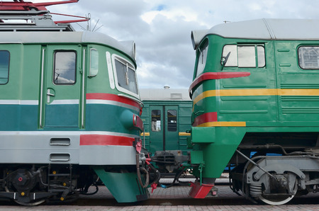 Cabs of modern Russian electric trains. Side view of the heads of railway trains with a lot of wheels and windows in the form of portholesのeditorial素材