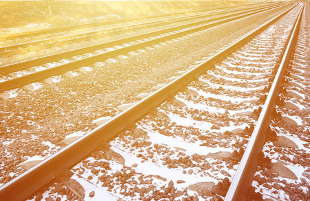 Details snowy Russian winter railway under bright sunlight. The rails and sleepers under the December snow. Russian Railways in detailの写真素材