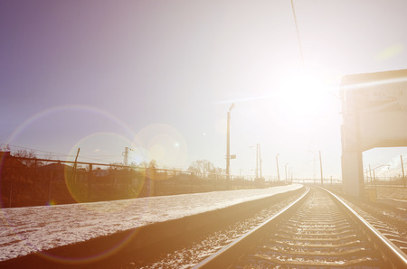 Empty railway station platform for waiting trains "Novoselovka" in Kharkiv, Ukraine. Railway platform in sunny winter dayの写真素材