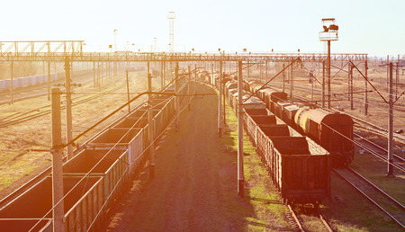 Railway landscape with many old railroad freight cars on the rails. Classic sunny day on the railroadのeditorial素材