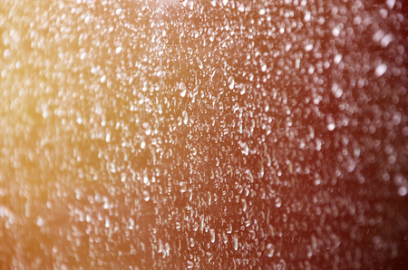 Background image of rain drops on a glass window. Macro photo with shallow depth of field. Toned pictureの写真素材