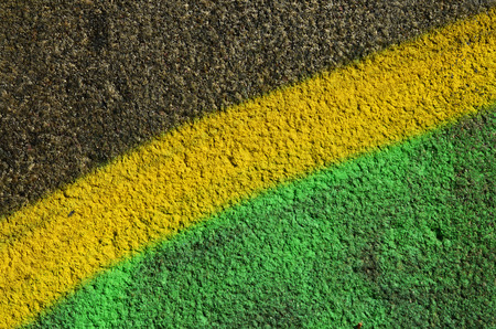 Concrete weathered worn wall damaged paint. Grungy Concrete Surface with graffiti colors and outlines. Street art background texture. Close up painted wall of the cityの写真素材