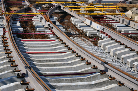 Fragment of tram rails at the stage of their installation and integration into the road. The process of laying a tramwayの写真素材