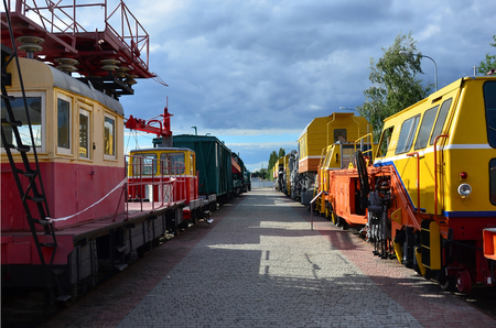 Cabs of modern Russian technical support electric trains and railway cranes. Side view of the heads of railway trains with a lot of wheelsのeditorial素材