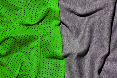 Top view of cloth textile surface. Close-up rumpled heater and knitted fabric texture with a thin striped pattern. Sport clothing fabric texture. Colored basketball shirt and heater hoodieの写真素材