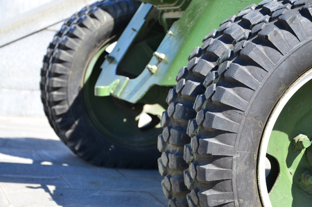 A close-up wheels of a portable weapon of the Soviet Union of World War II, painted in a dark greenのeditorial素材