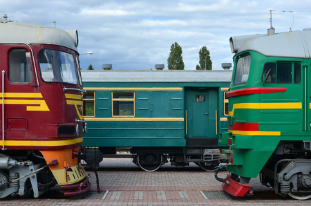 Cabs of modern Russian electric trains. Side view of the heads of railway trains with a lot of wheels and windows in the form of portholesのeditorial素材