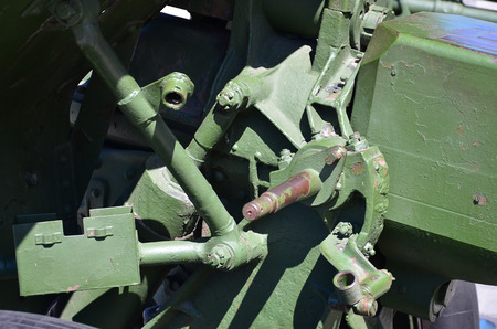 A close-up mechanism of a portable weapon of the Soviet Union of World War II, painted in a dark green colorのeditorial素材