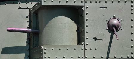 The texture of the wall of the tank, made of metal and reinforced with a multitude of bolts and rivets. Images of the covering of a combat vehicle from the Second World War with a guided machine gunの写真素材