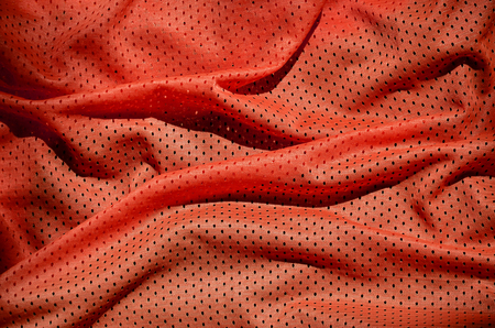 Close up of red polyester nylon sportswear shorts to created a textured backgroundの写真素材