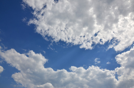 Beautiful blue sky background template with some space for input text message below isolated on blueの写真素材