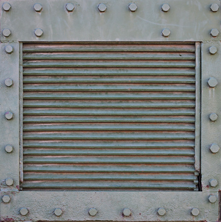The texture of the wall of the tank, made of metal and reinforced with a multitude of bolts and rivets. Images of the covering of a combat vehicle from the Second World Warの写真素材