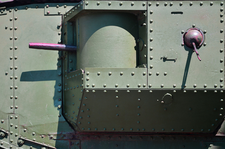 The texture of the wall of the tank, made of metal and reinforced with a multitude of bolts and rivets. Images of the covering of a combat vehicle from the Second World War with a guided machine gunの写真素材