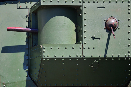 The texture of the wall of the tank, made of metal and reinforced with a multitude of bolts and rivets. Images of the covering of a combat vehicle from the Second World War with a guided machine gunの写真素材